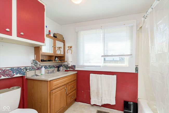 bathroom featuring toilet and vanity | Image 24