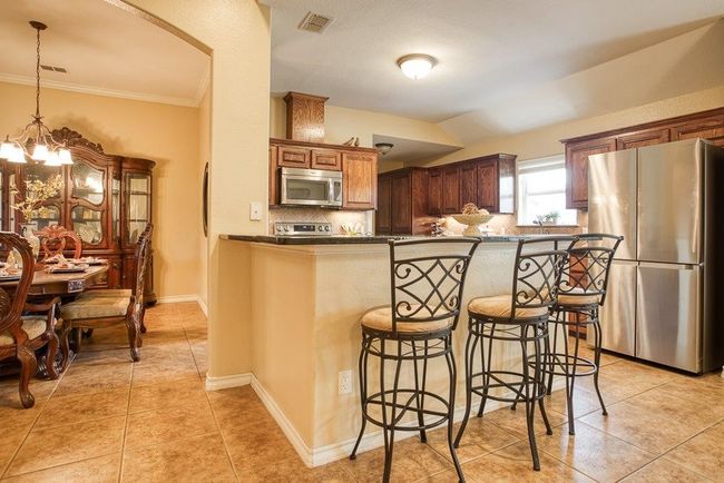 Island with extra seating and a wine/coffee bar | Image 14