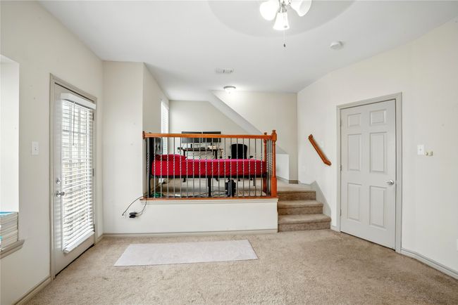 Carpeted bedroom featuring access to exterior and ceiling fan | Image 20