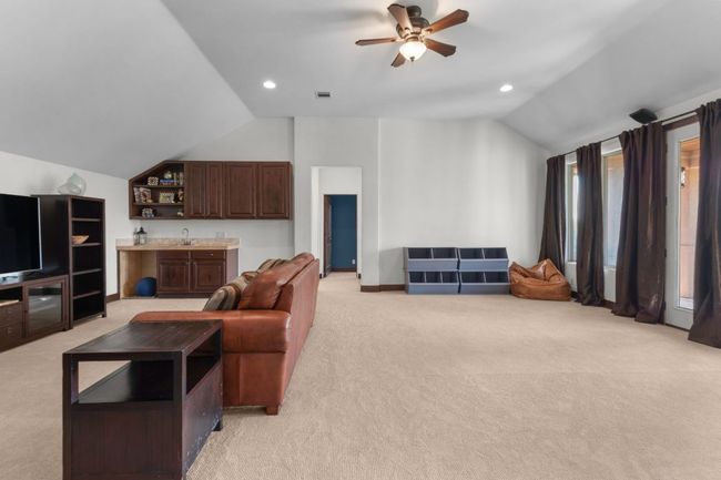 Living room featuring vaulted ceiling, light carpet, ceiling fan, recessed lighting | Image 21