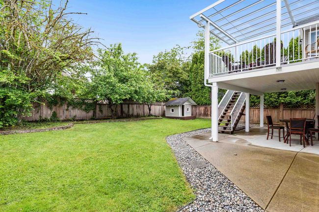 View of yard featuring stairway and a patio | Image 27