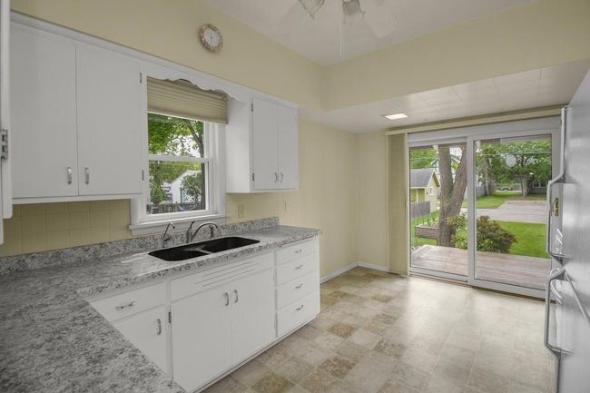 Kitchen with access to deck and patio | Image 10