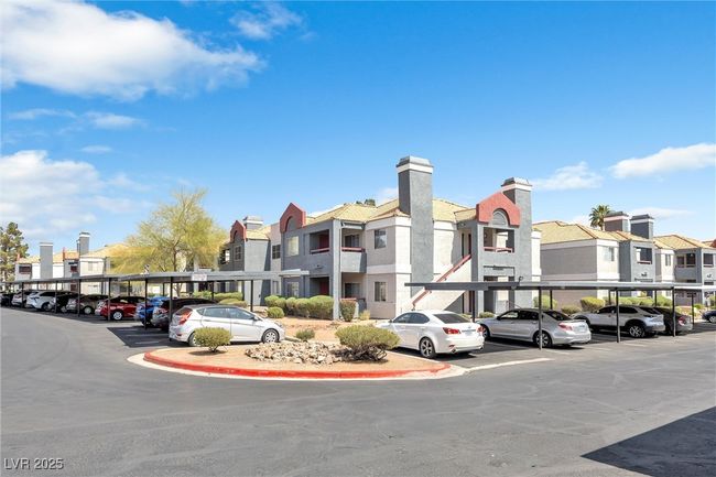 View of property featuring covered parking and a residential view | Image 24