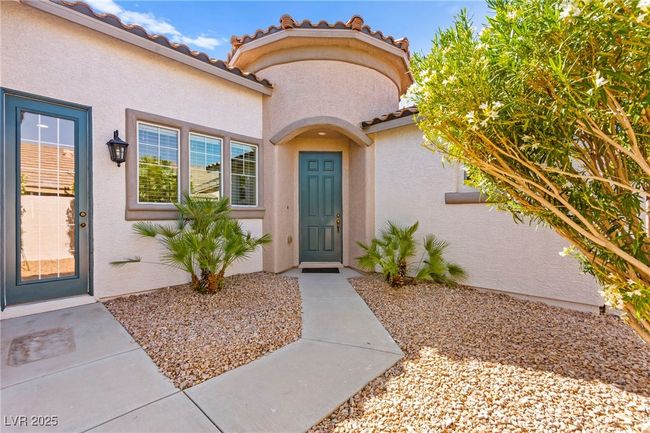 Doorway to property with stucco siding and a tiled roof | Image 46
