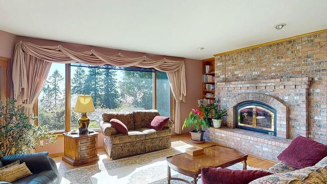 Living area with loads of natural light & stone fireplace | Image 18