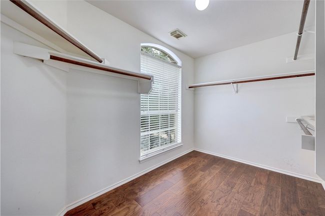 Walk in closet featuring wood finished floors | Image 25