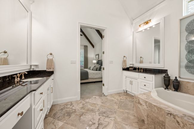 Ensuite bathroom with vanity, a garden tub, and crown molding | Image 20