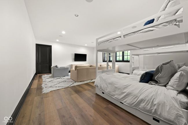 Bunk Room with dark wood-style floors and recessed lighting | Image 82