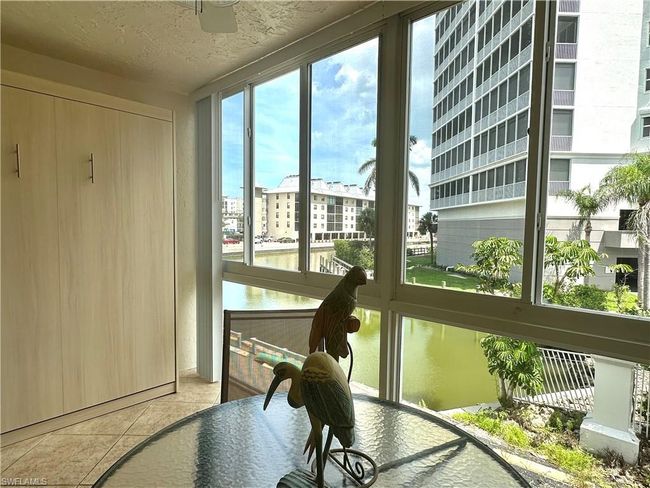The newly up-fitted Hurricane impact glass two-tier sliding widows with screens provide storm protection and views of Water Turkey Bay and the Vanderbilt Lagoon. | Image 5