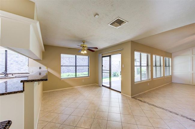Spacious dining area with breakfast bar! | Image 9