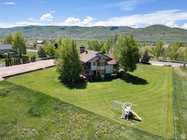 View of subject property with a mountain backdrop | Image 75