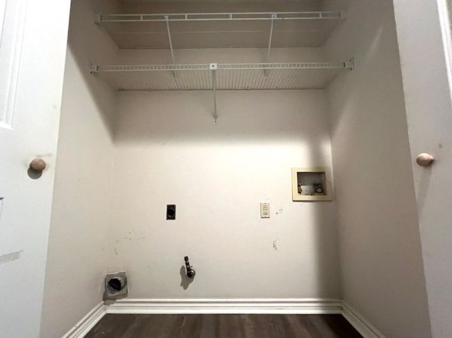 Laundry area featuring hookup for a washing machine, dark wood-style floors, and hookup for an electric dryer | Image 27