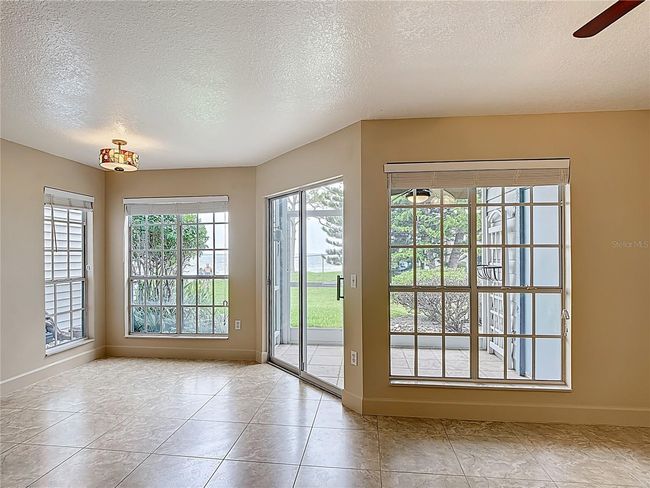 Screened in porch beside dining area | Image 7