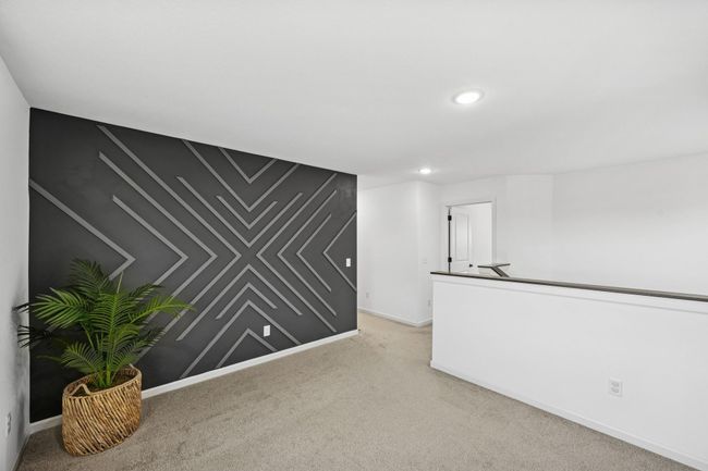 Sellers have another designer accent wall in the loft area. | Image 18