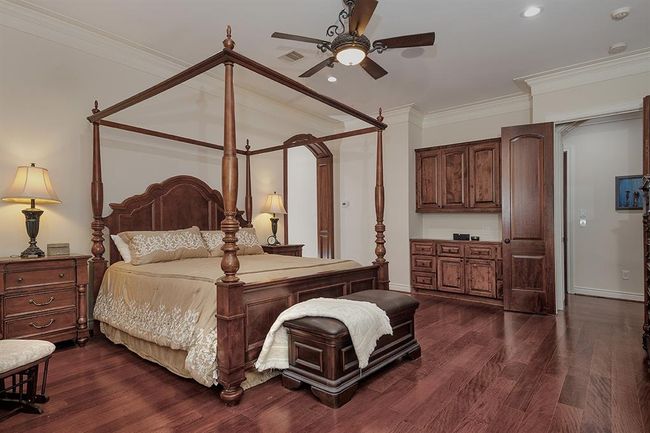 The owner's retreat has beautiful built-ins and a door leading to the screened-in patio | Image 20