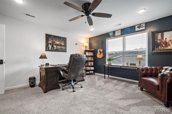 Carpeted office space featuring a ceiling fan and recessed lighting | Image 40