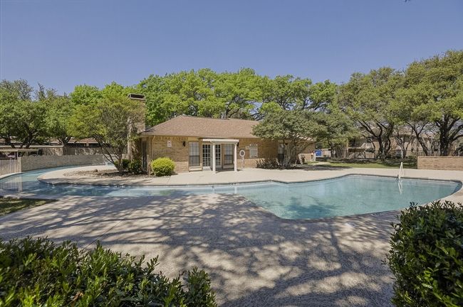 Pool with a patio area and fence | Image 26
