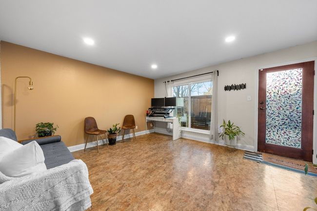 Den featuring an open space for a home office, library or family room that connects to the patio | Image 13