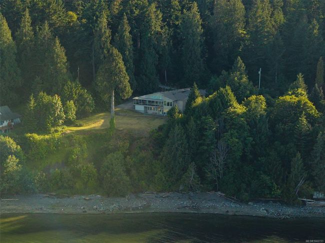 Aerial view of property and surrounding area featuring a forest | Image 4