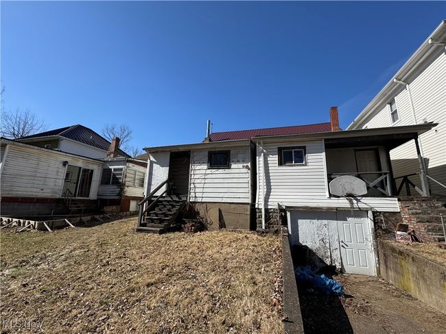 Back of property with metal roof and a chimney | Image 4