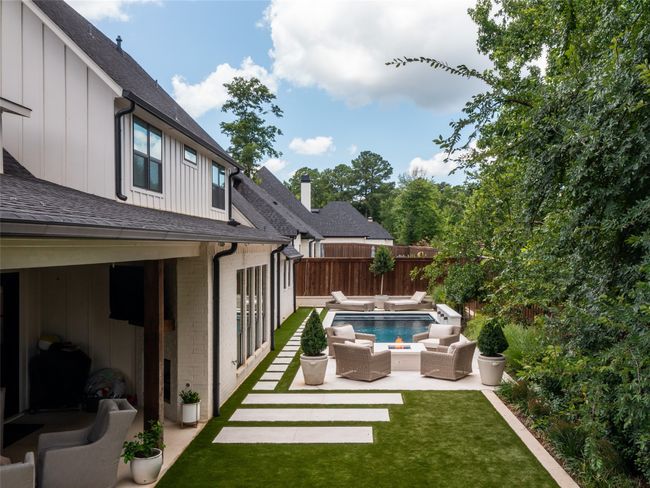 View of swimming pool featuring a patio, outdoor lounge area, and a fenced backyard | Image 33