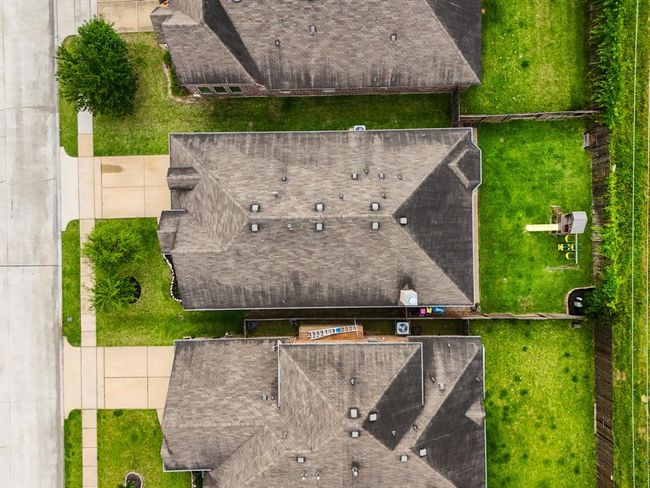 Another bird’s-eye view from above reveals the home’s well-designed layout and generous outdoor space, giving a clear sense of the flow between indoor comfort and the expansive backyard. | Image 41