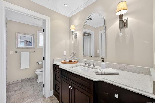 updated Full bath on second floor with separate toilet and tub/shower room, and large linen | Image 28