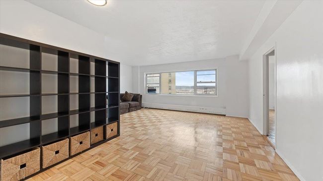 Unfurnished room with a baseboard heating unit and baseboards | Image 4