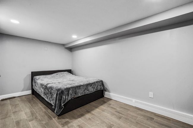 Bedroom featuring recessed lighting, wood finished floors, and baseboards | Image 12