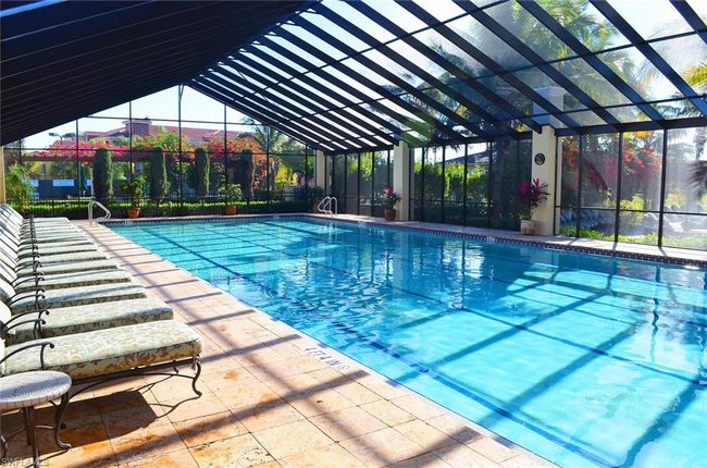 View of swimming pool featuring screen enclosure | Image 29