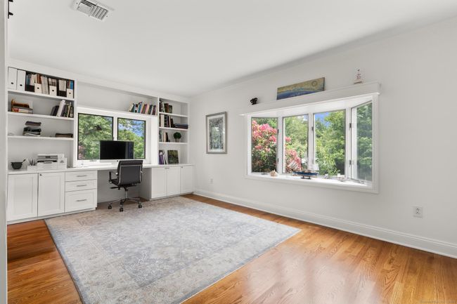 Primary bedroom suite currently used as an office | Image 25