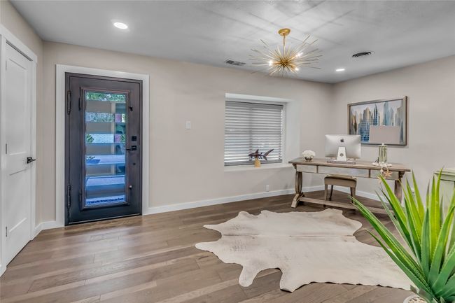 Office with wood finished floors, recessed lighting, and a chandelier | Image 6