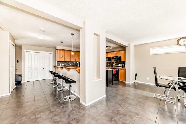 66 Evansbrooke Terr Nw, House other with 5 bedrooms, 4 bathrooms and 4 parking in Calgary AB | Image 9