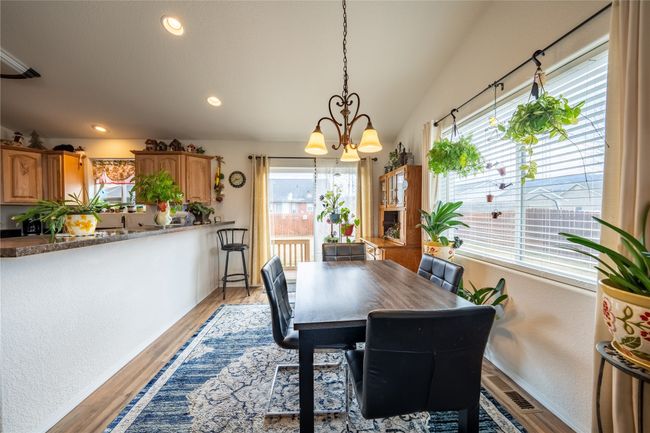 Dining room with recessed lighting, a notable chandelier, and light wood-style flooring | Image 6