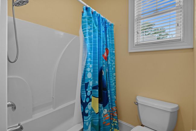 Full bath featuring toilet and shower / bath combo | Image 27