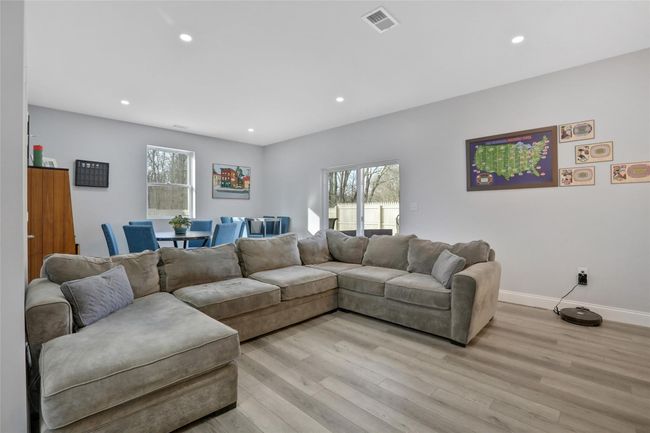 Living room featuring light hardwood / wood-style flooring | Image 26