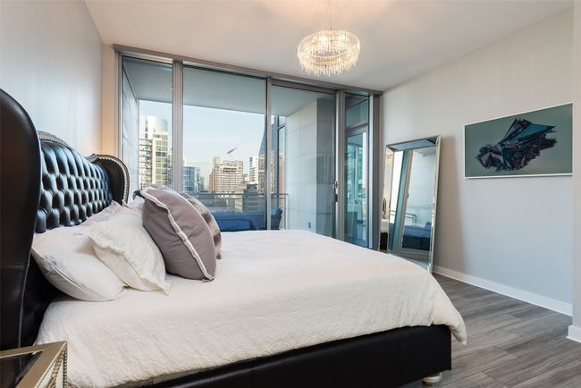 Primary bedroom with balcony access. | Image 7