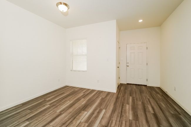 Empty room featuring dark wood-type flooring and recessed lighting | Image 15