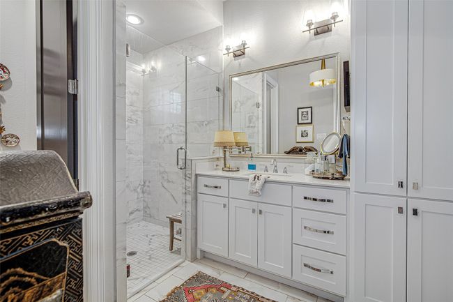 Full bathroom featuring a shower stall and vanity | Image 19