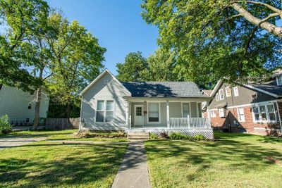 View of front facade featuring a front lawn and covered porch | Image 1