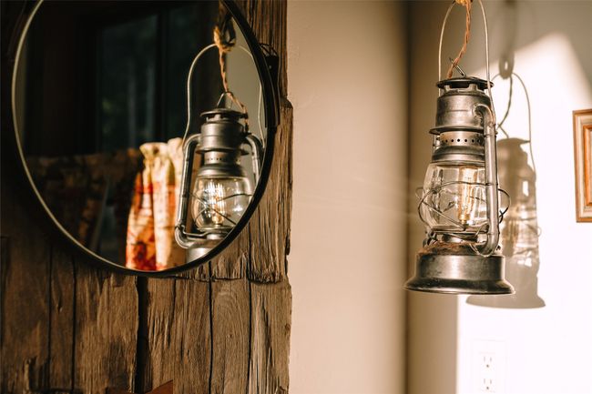 Main bathroom also features uniquely designed lighting, a vanity with antique hand forged branding iron legs, copper sinks and a copper soaking | Image 33