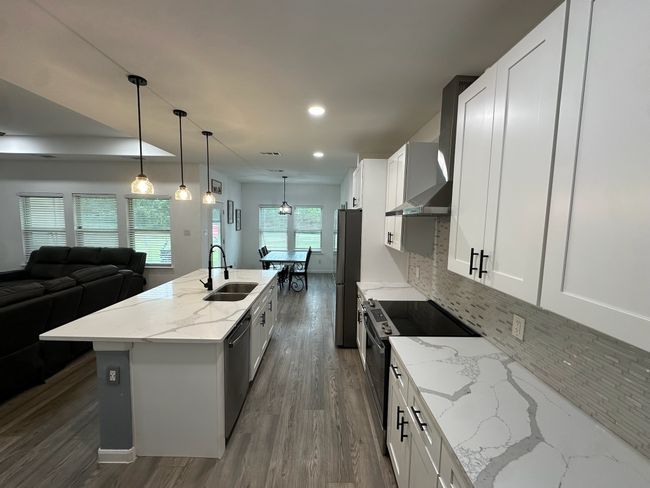 Bathroom with marble finish floors and double vanity | Image 19