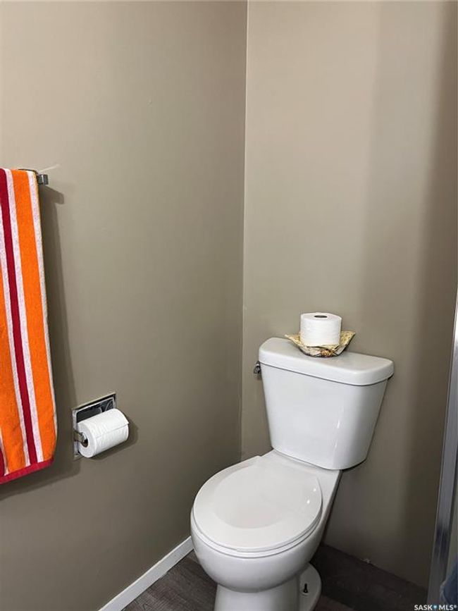 Bathroom featuring toilet and baseboards | Image 33
