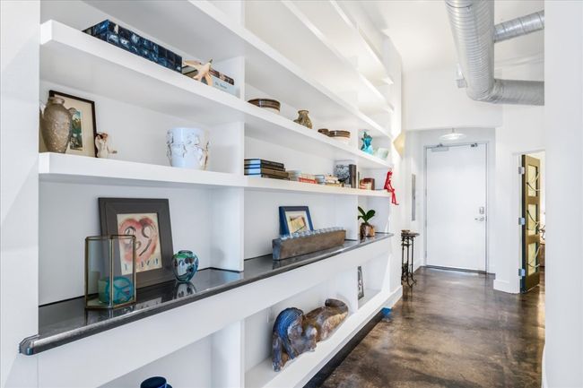 Hall with finished stained concrete floors | Image 24