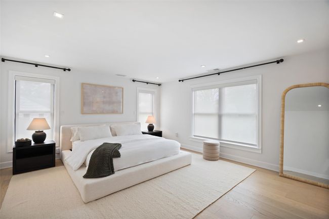 Bedroom featuring baseboards, wood finished floors | Image 17