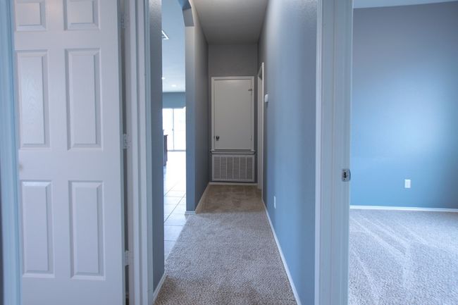 Hall with carpet and baseboards | Image 30