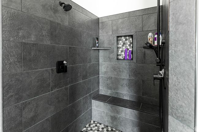 Bathroom featuring a tile shower | Image 13