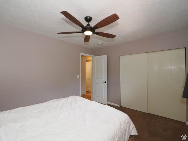 Bedroom featuring carpet floors, a ceiling fan, and a closet | Image 25
