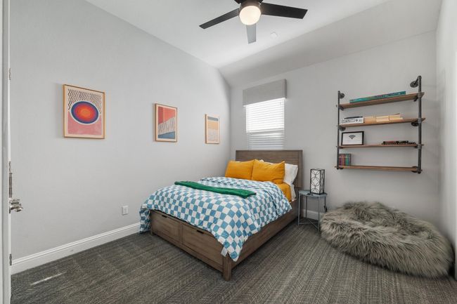 This is the fifth bedroom that features industrial styled shelving, ceiling and plush carpet. | Image 33