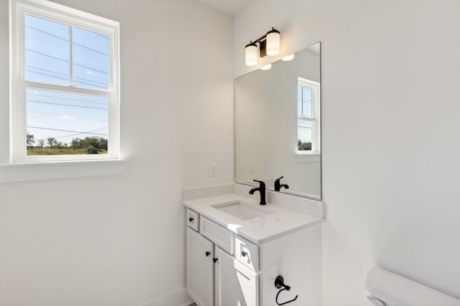 Both full bathrooms enjoy windows and attractive appointments! Actual photo of home. | Image 27